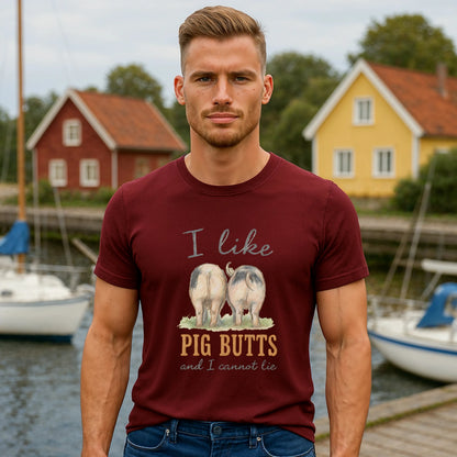Alt Tag: I Like Pig Butts Vintage Premium Unisex T-Shirt on model wearing burgundy graphic tee with pig butts design near harbor