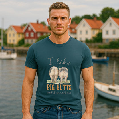 I Like Pig Butts Vintage Premium Unisex T-Shirt on model wearing teal graphic tee with pig illustration by waterfront