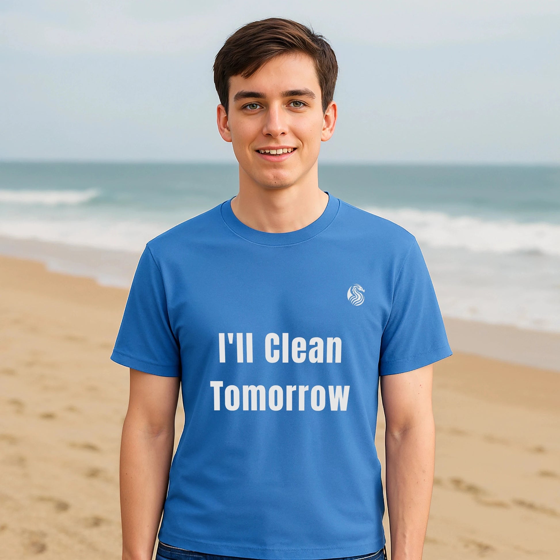 I'll Clean Tomorrow Teen Premium Unisex T-Shirt blue graphic tee with "I'll Clean Tomorrow" text, front view model on beach