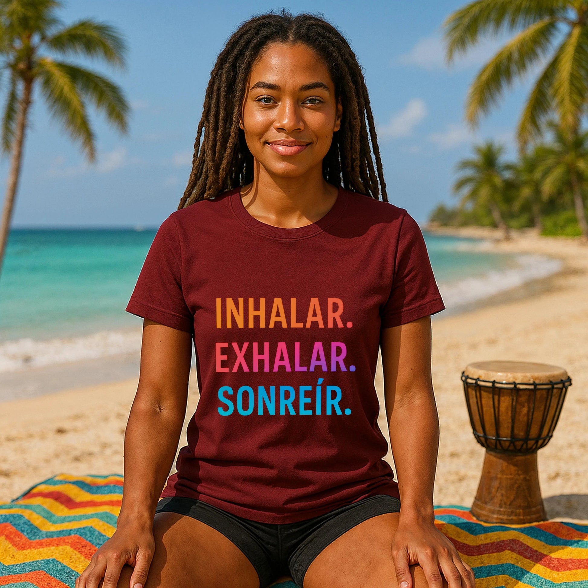 Alt Tag: Inhalar Exhalar Sonreír Sostenible Vivir Lento 100% Organic Cotton T-Shirt en color burdeos con texto INHALAR EXHALAR SONREÍR, modelo en playa