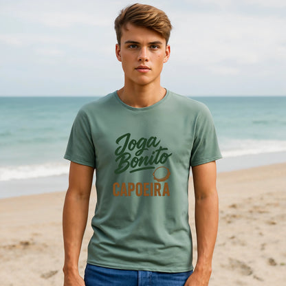 Alt Tag: Joga Bonito Capoeria Sustainable Unisex Tee green capoeira graphic t-shirt worn by model on beach