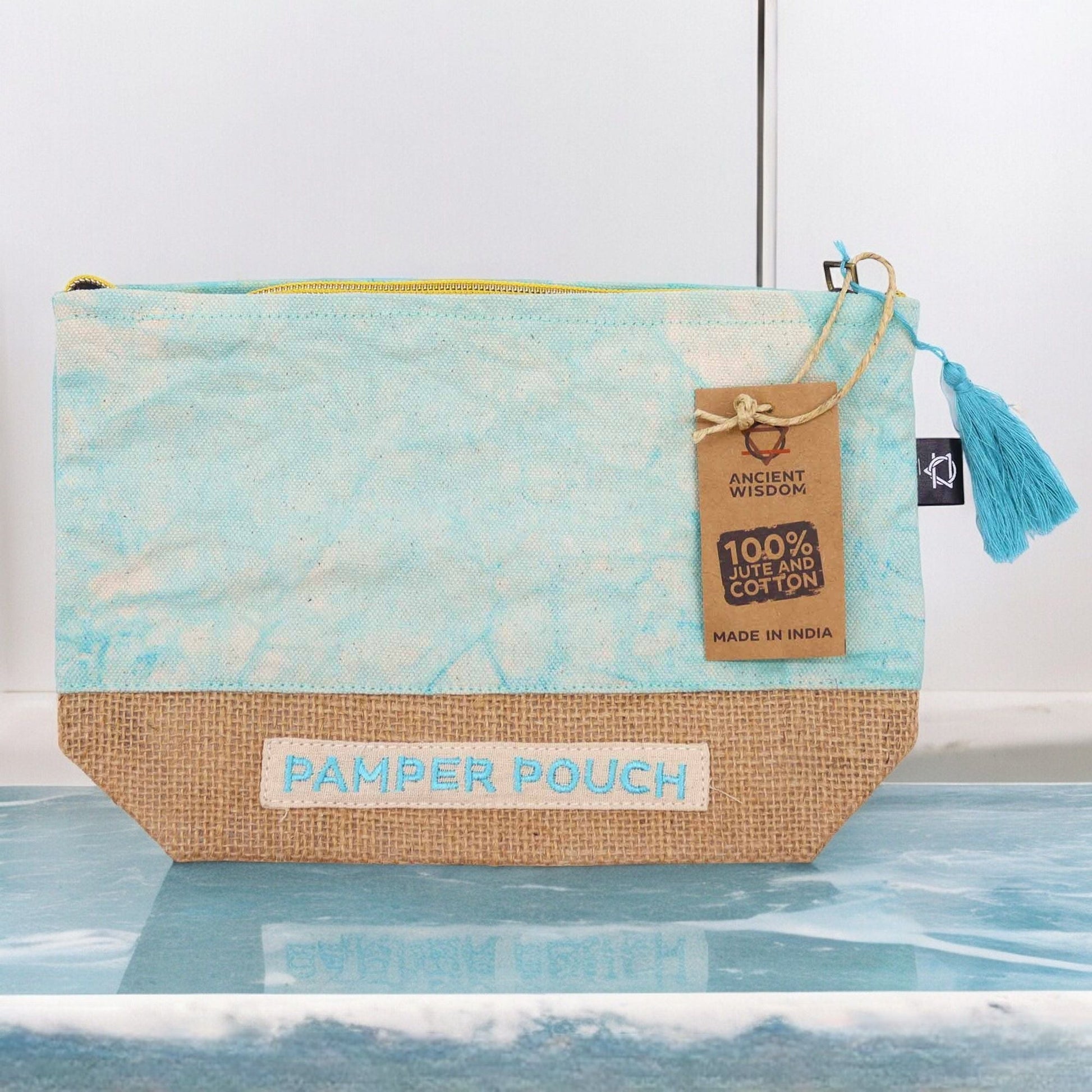 Alt Tag: Jute & Cotton Pamper Pouch – Stonewash Blues zip pouch in blue with jute base, tassel pull and label, 25x7x15 cm