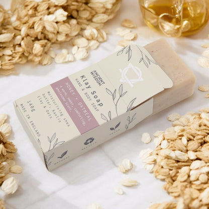 Kaolin Clay Soap – Honey Oatmeal 145G barra de jabón artesanal en caja, con avena y miel alrededor