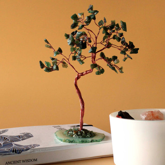Large Green Aventurine Gemstone Tree – 100 Stones on green agate base, decorative gemstone bonsai on book beside white bowl