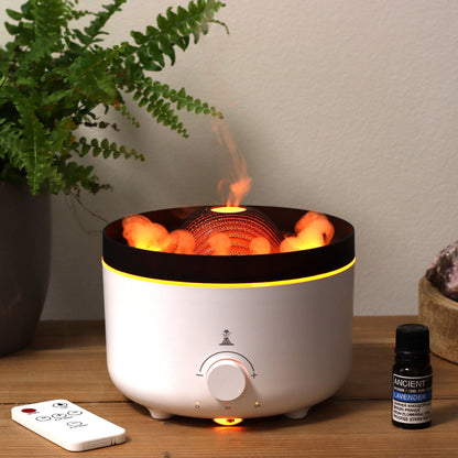 Large Volcano Effect Aroma Diffuser (Plug) – Two Colours with volcano-style mist effect on table next to essential oil bottle