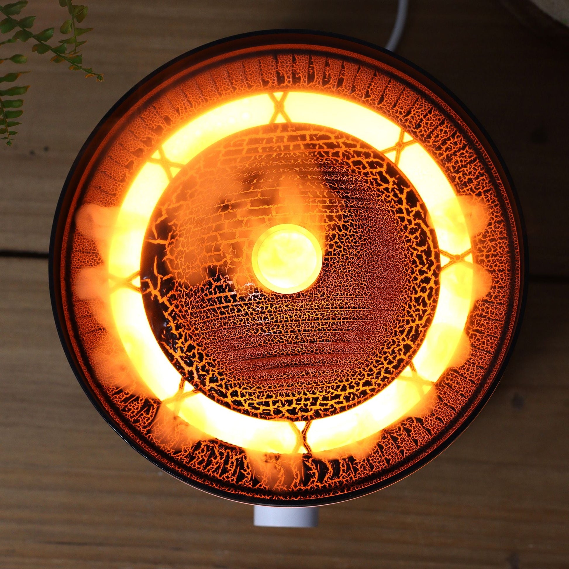 Large Volcano Effect Aroma Diffuser (Plug) – Two Colours with glowing volcano-style mist effect, top view on wooden surface