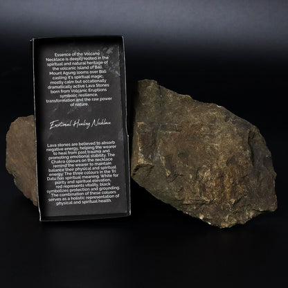 Lava Stone 7-Chakra Necklace – Emotional Harmonizing packaging box with lava stone rocks on black background