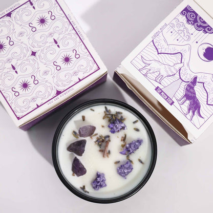 Alt Tag: Lavender Amethyst Crystal Candle – The Moon with lavender botanicals and amethyst stones in tin, shown with moon-themed packaging