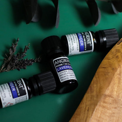 Lavender Essential Oil – 10 ML bottle by Ancient Wisdom with lavender sprigs on green background