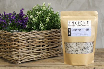 Alt Tag: Lavender Himalayan Bath Salt – Relax 500G pouch of Himalayan salt blend with lavender seeds on wooden table