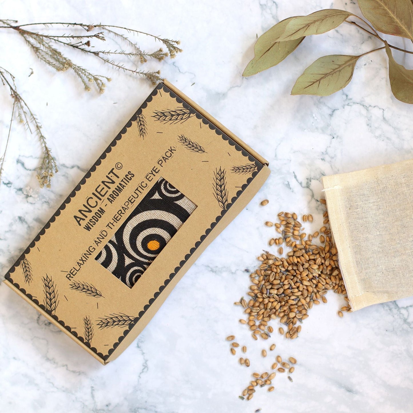 Lavender Natural Cotton & Juco Eye Pillow in Gift Box – Illusion with patterned box, flaxseed filling and fabric pouch on marble surface