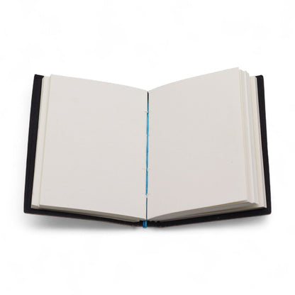 Leather Chakra Notebook – 17.5x13 CM open view with blank pages and black leather cover on white background