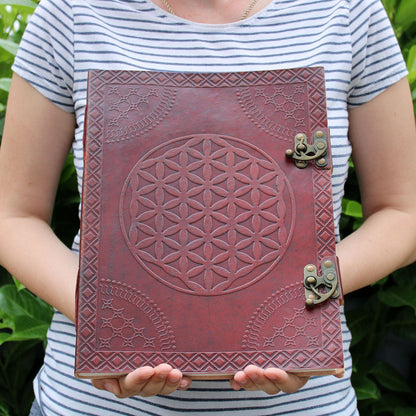 Leather Flower of Life Journal – 200 Pages, 25x32.5 CM leather cover with embossed Flower of Life design and metal clasps, held in hands