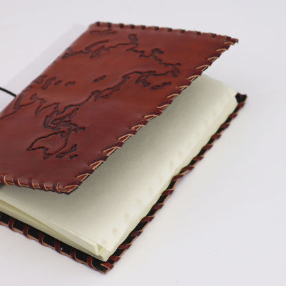 Alt Tag: Light Tan Leather Journal – 17x13 CM, 96 Pages, leather notebook with stitched edges and embossed map cover, open to blank pages