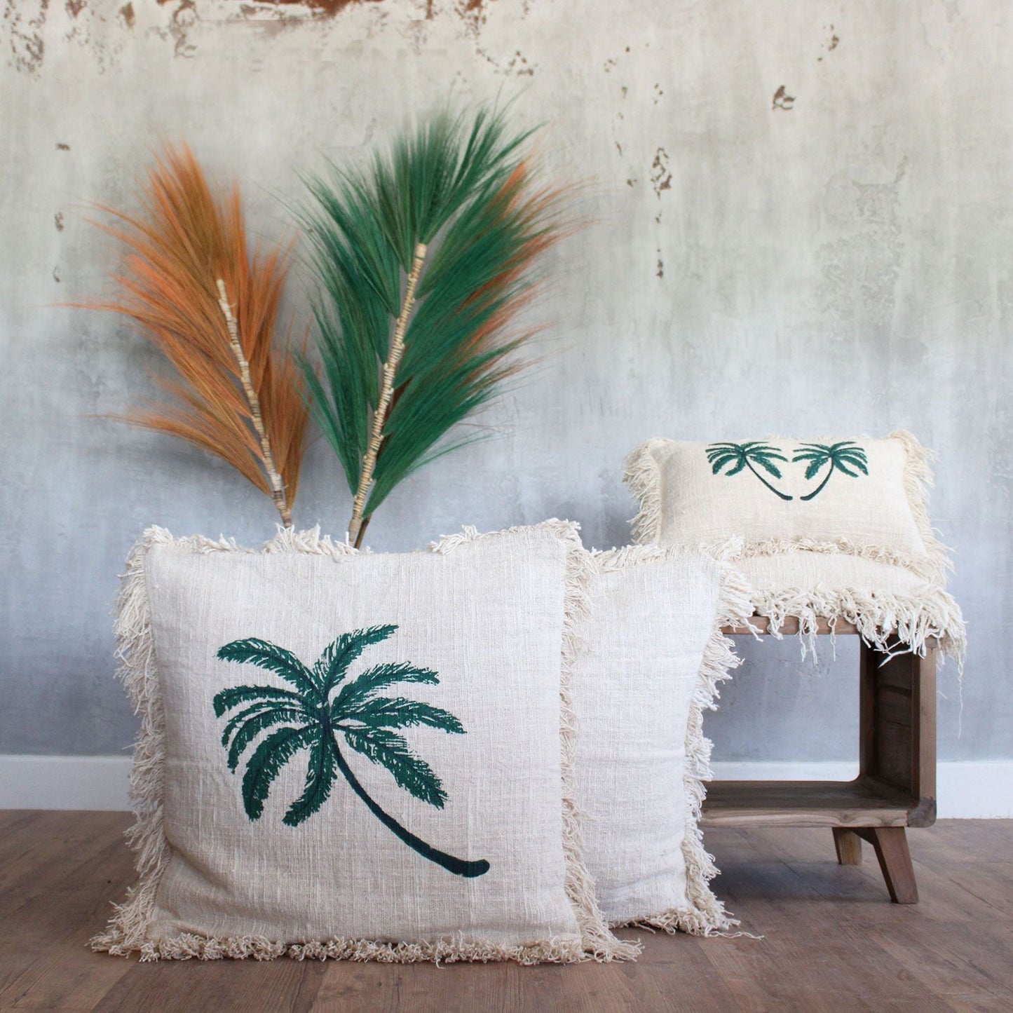 Linen Palm Tree Cushion – 45x45 CM linen and cotton cushion cover with embroidered palm tree design, neutral fringe, styled on floor