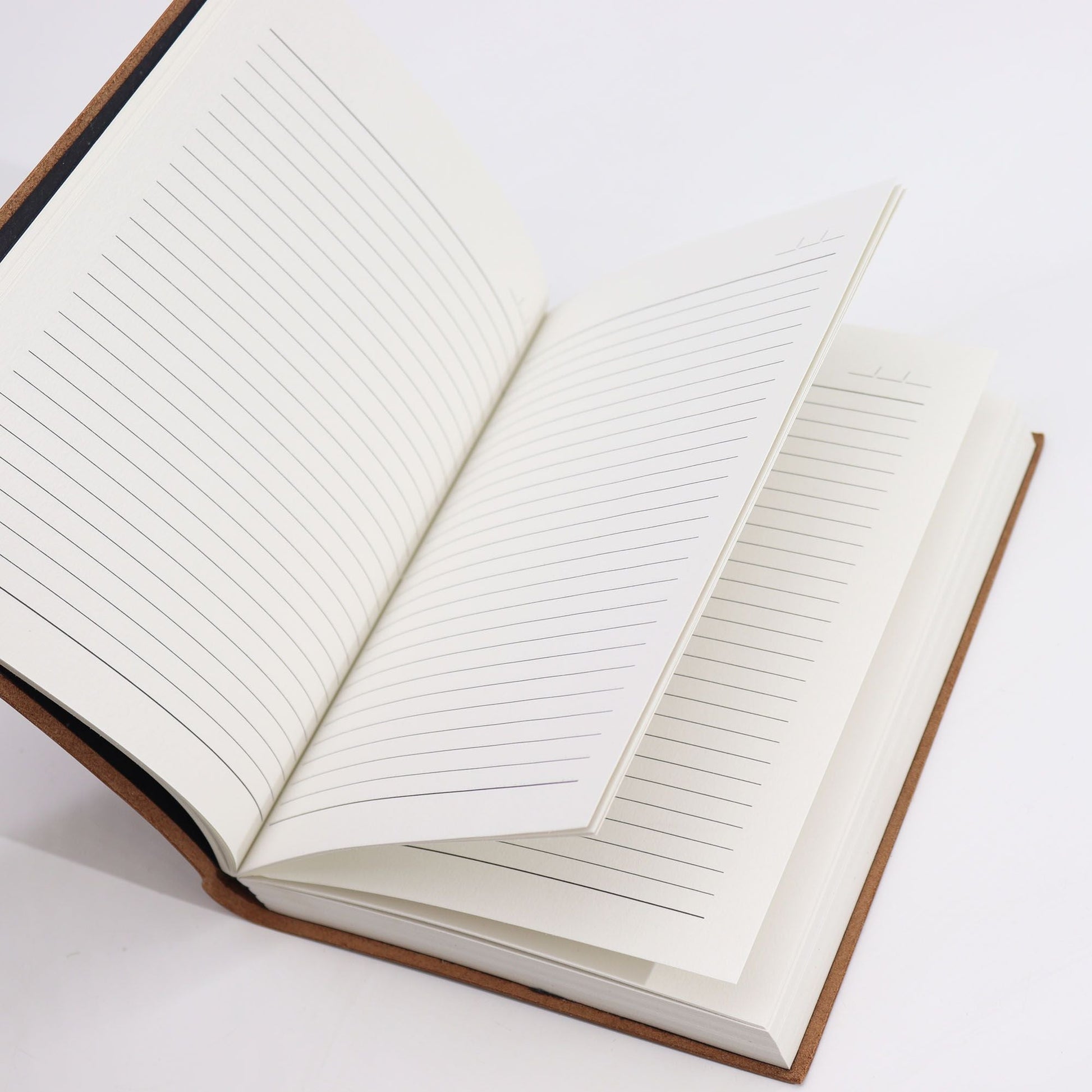 Luxurious Leather Notebook – 100 Lined Pages, 20x15 CM open notebook showing lined pages and leather cover