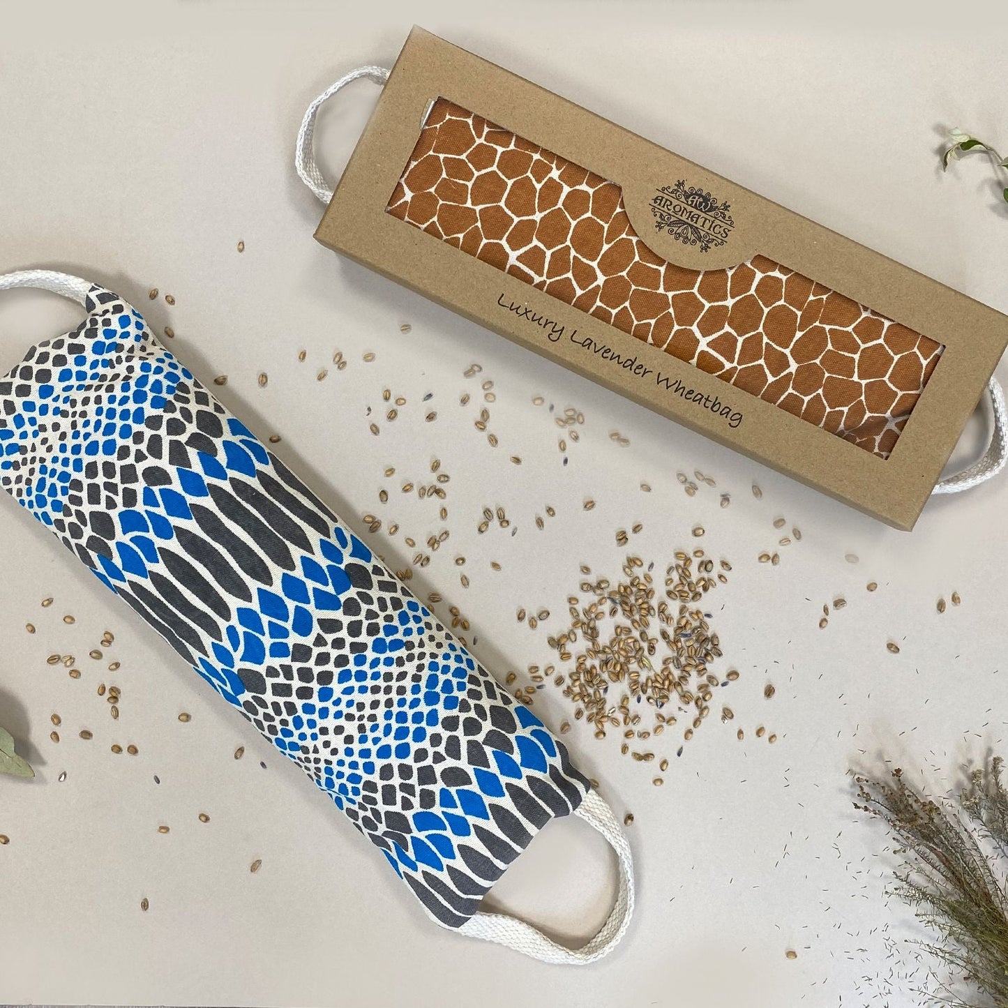 Alt Tag: Luxury Lavender Wheat Bag – Comfort Edition in gift box with patterned polyester wheat bag and scattered wheat grains