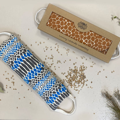 Alt Tag: Luxury Lavender Wheat Bag – Comfort Edition in gift box with patterned polyester wheat bag and scattered wheat grains