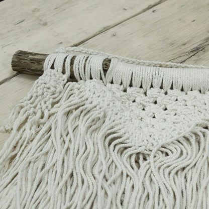 Alt Tag: Macramé Wall Hanging – Natural Abundance in natural cotton with fringe and knotted detail on rustic wooden dowel