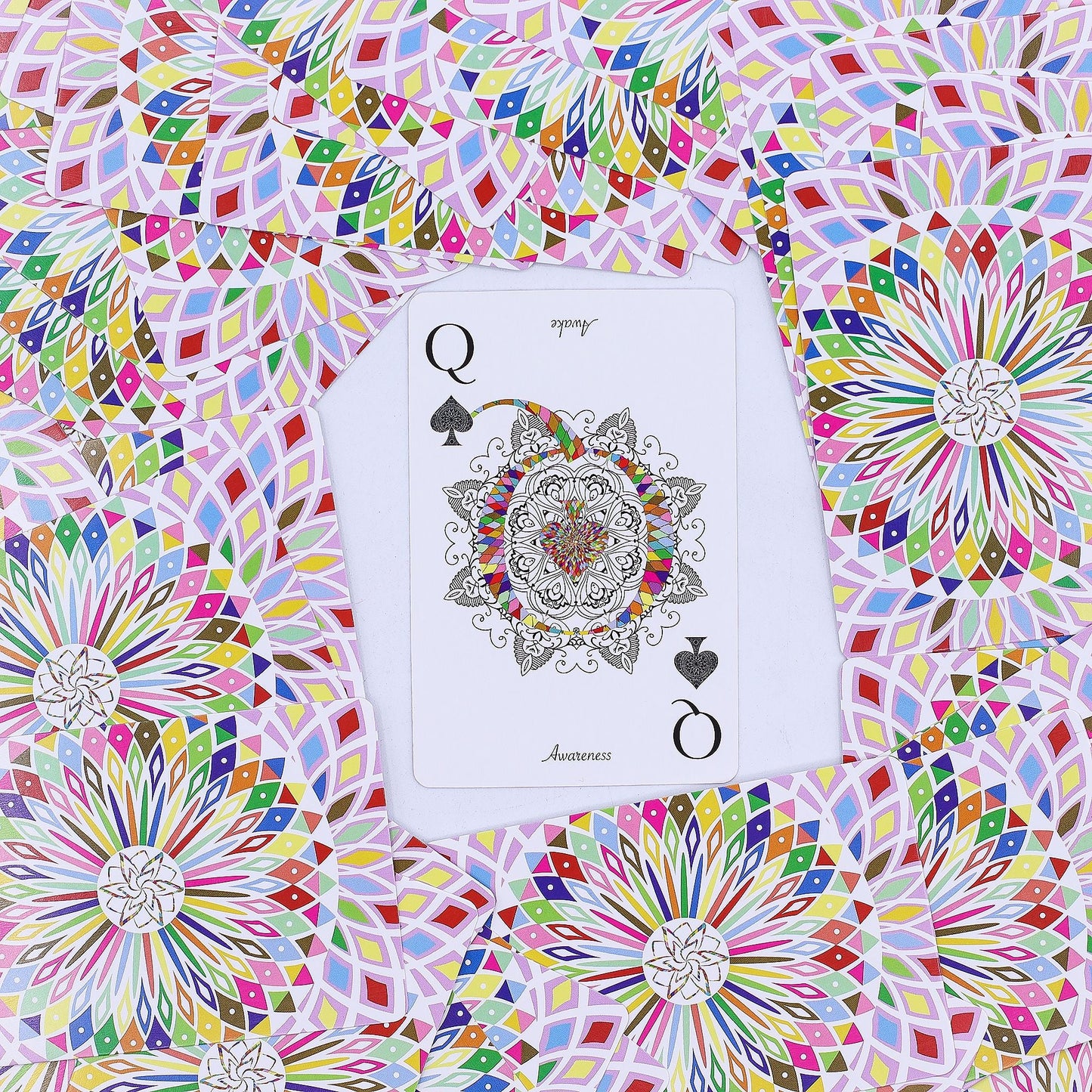 Alt Tag: Mandala Playing & Oracle Cards – Kaleidoscope Symmetry Queen of Spades card with colorful mandala design on patterned background
