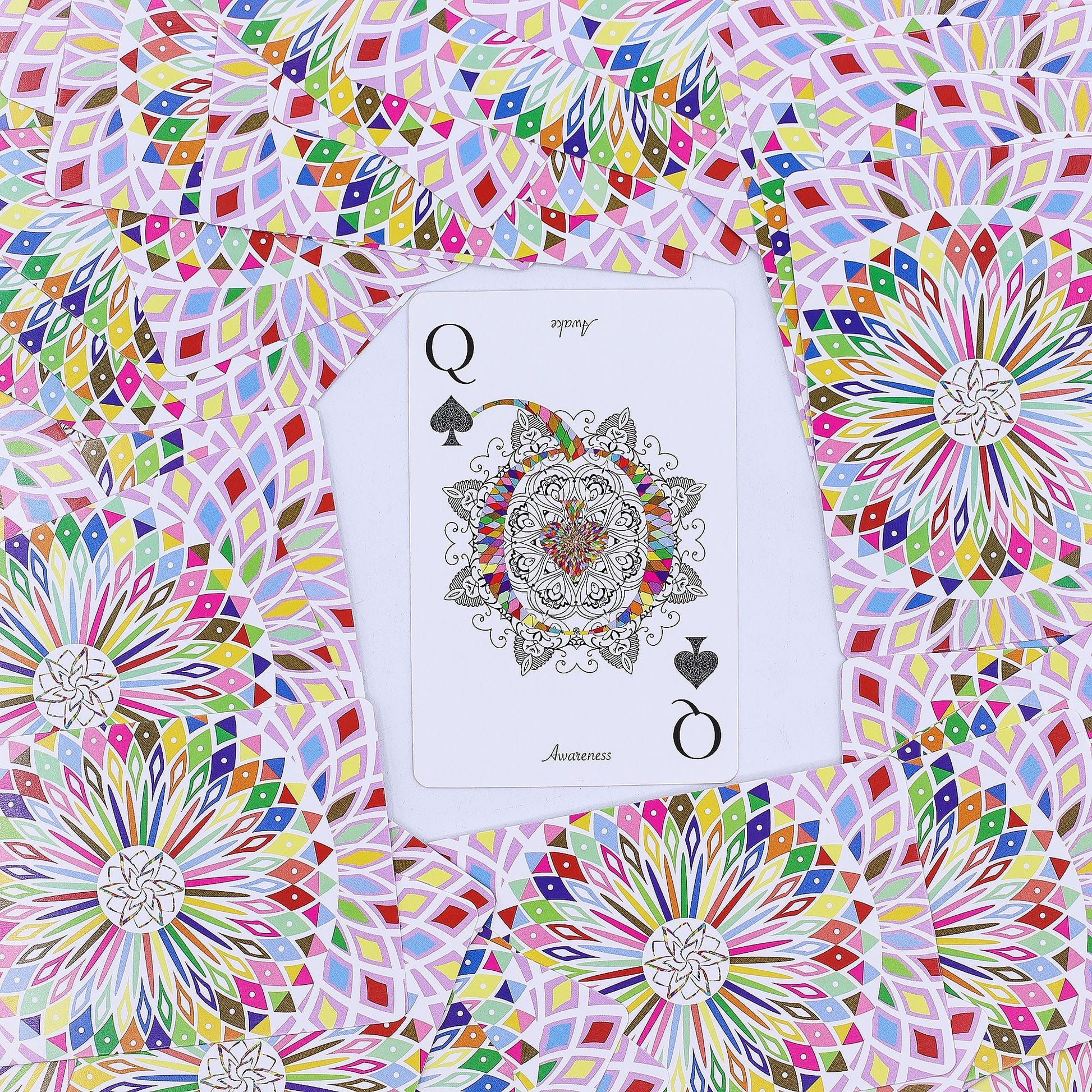 Alt Tag: Mandala Playing & Oracle Cards – Kaleidoscope Symmetry Queen of Spades card with colorful mandala design on patterned background