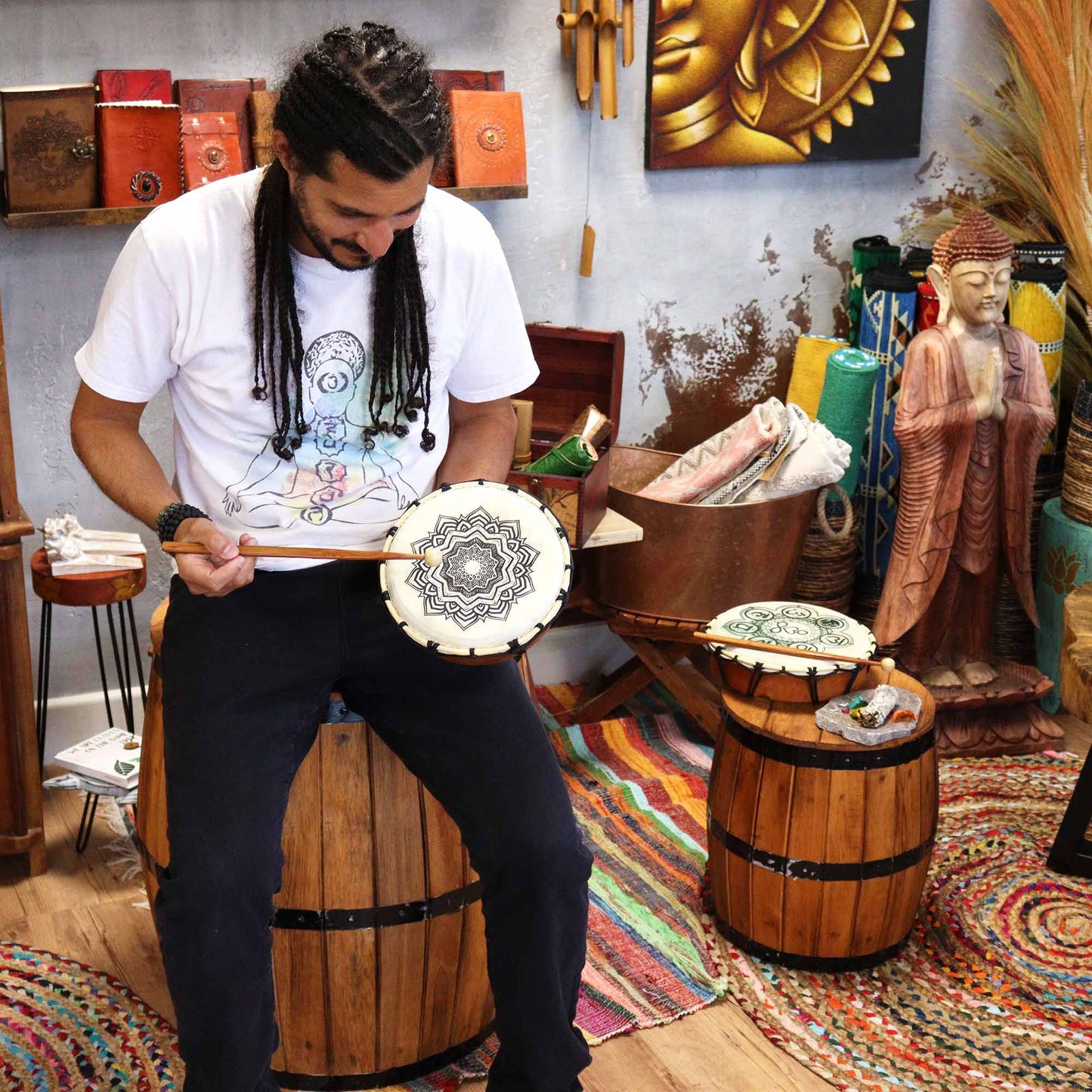 Mandala Shamanic Drum with Sticks – 20 CM handheld drum with mandala design, shown being played in a spiritual decor setting