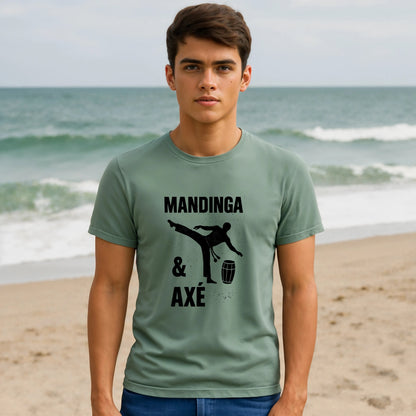 Mandinga Axe Capoeira Premium Unisex T-Shirt worn by model, green tee with Mandinga & Axé capoeira kick and berimbau graphic on beach