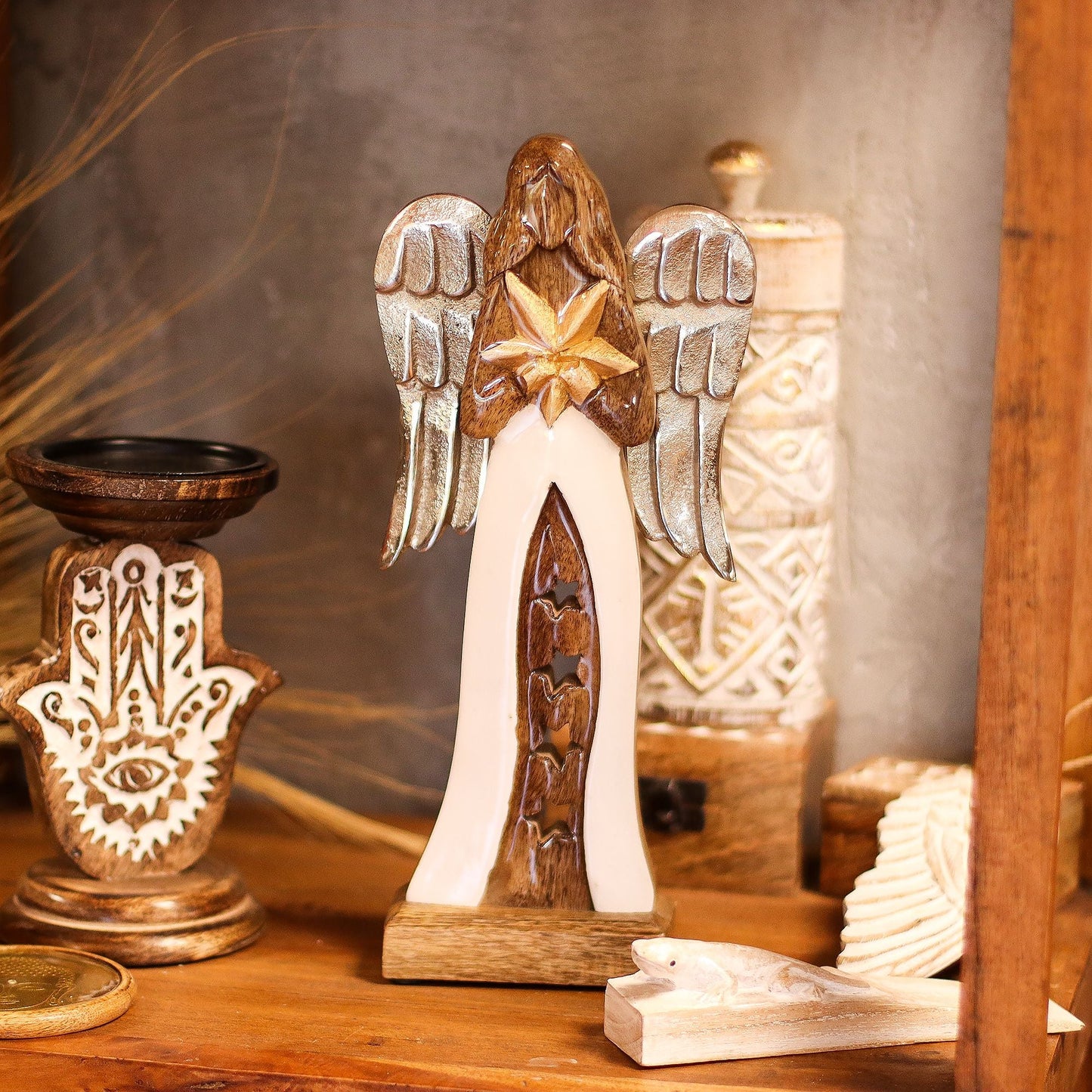 Alt Tag: Mango Wood Angel – 30 CM Hand-Carved Elegance figurine with metal wings and white enamel robe on wooden shelf