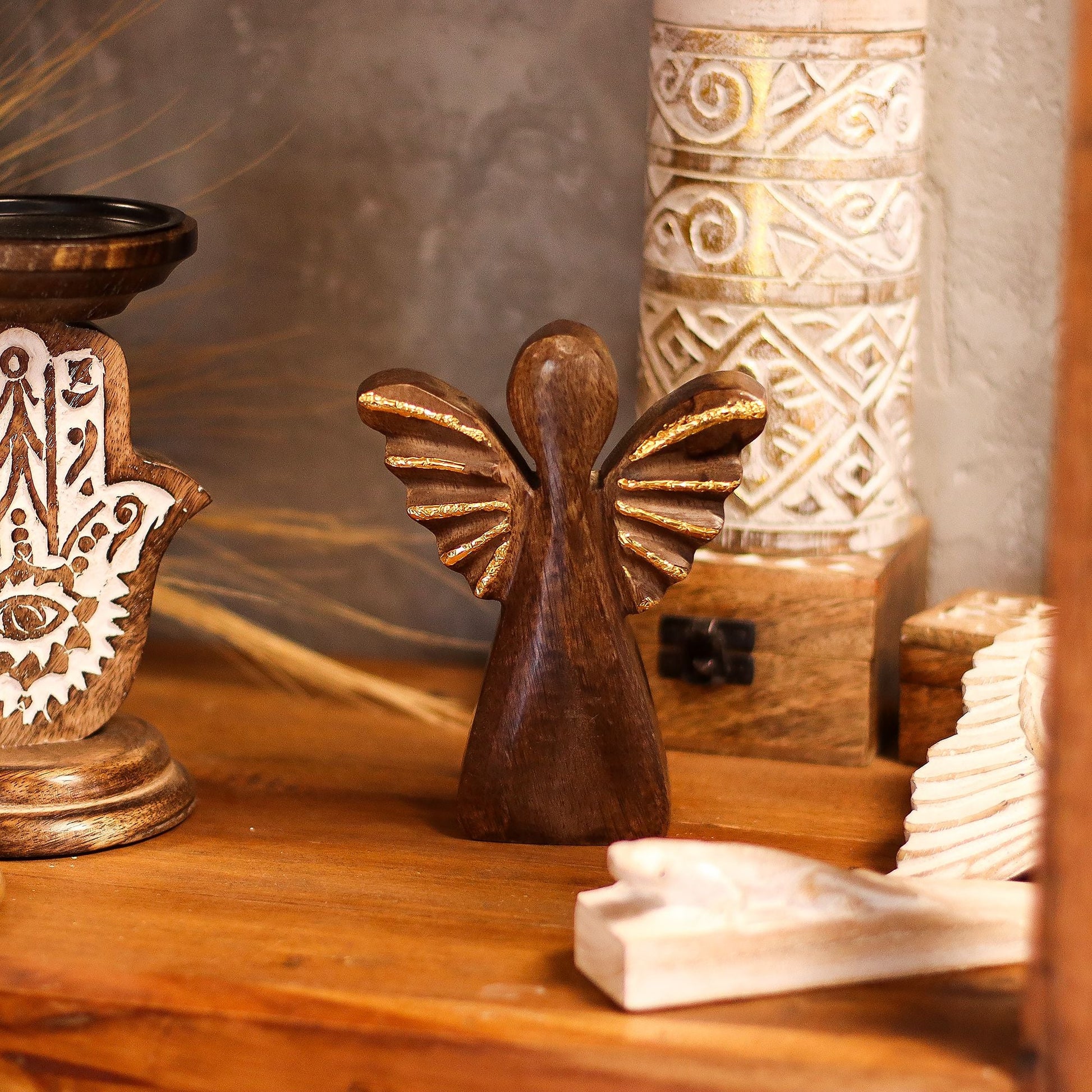 Alt Tag: Mango Wood Angel – Gold Wings 16CM hand-carved wooden angel decor with shimmering gold wings on a mantel
