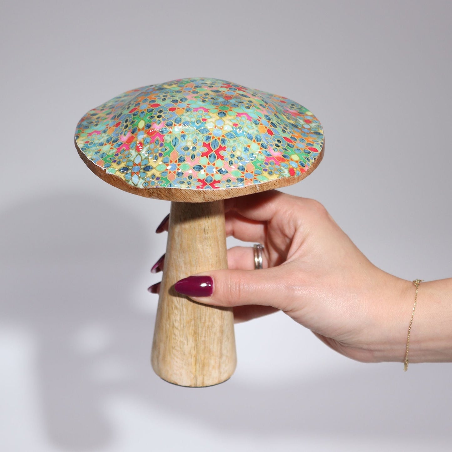 Alt Tag: Mango Wood Mushroom – 15 CM Pastel Hearts, handcrafted mango wood decor mushroom with pastel heart-pattern cap, held in hand