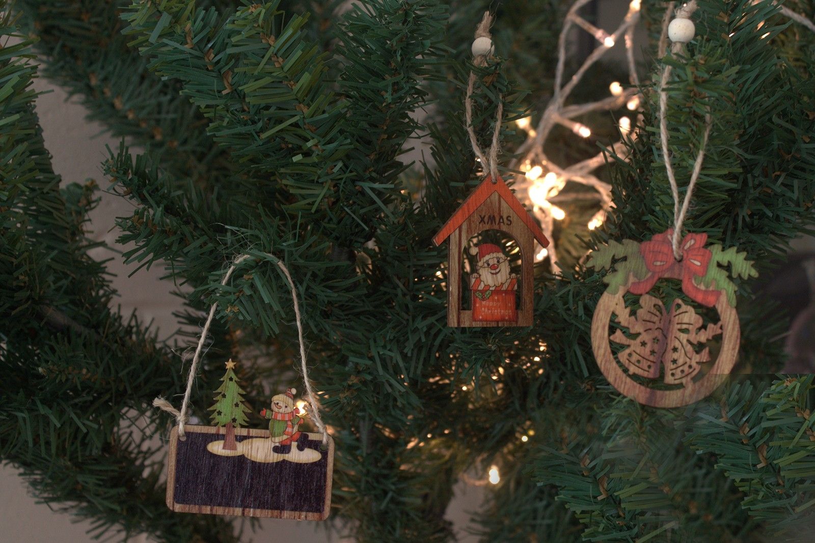 Alt Tag: MDF Christmas Décor – Snowman & Tree Set wooden ornaments hanging on Christmas tree with lights, snowman and tree designs