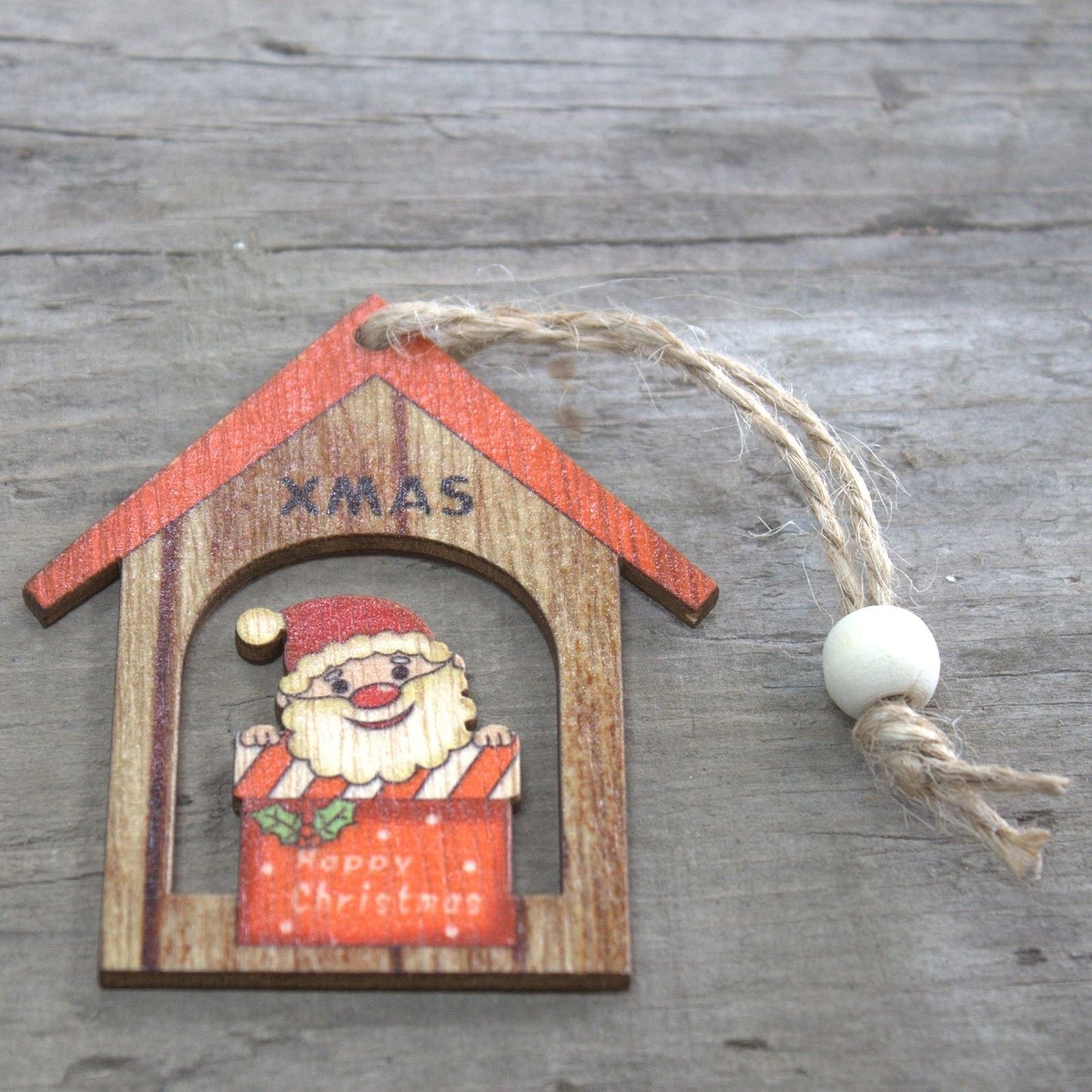Alt Tag: MDF Christmas Wooden Santas – 7x7 CM (Pack of 2), wooden Santa house ornament with twine hanger on rustic wood background