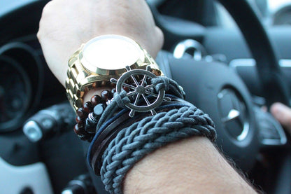 Men’s Bracelet Set – Moody & Blue (Assorted) on wrist with navy beads, braided cord and metal accents, styled in car interior