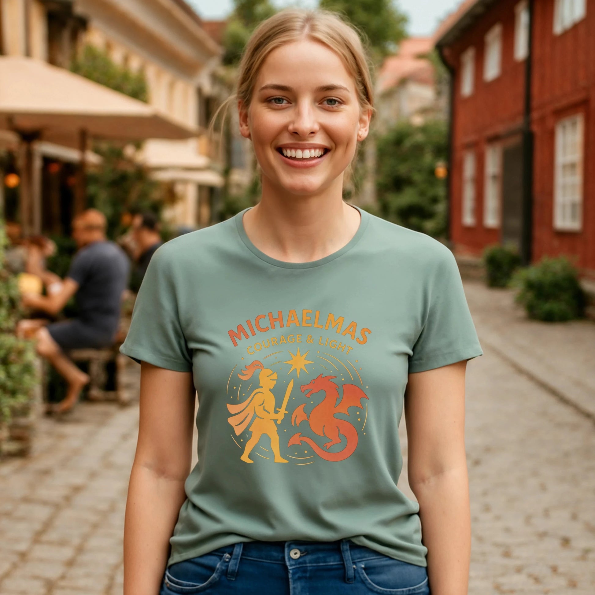 Alt Tag: Model wearing Michaelmas Courage Ans Light 100% Organic Cotton T-Shirt with illustrated dragon graphic, outdoors on a street