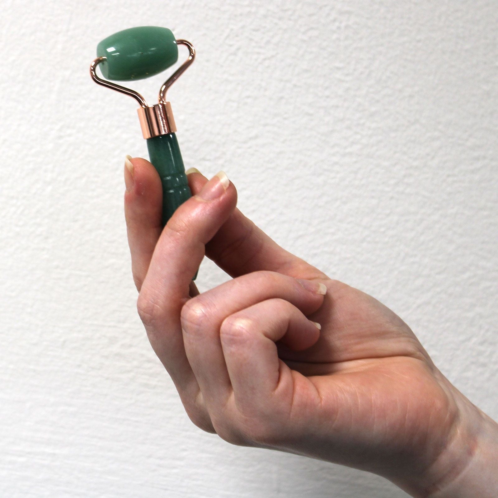 Amethyst Gemstone Face Roller – Mini 9 CM handheld mini gemstone face roller with metal frame, close-up