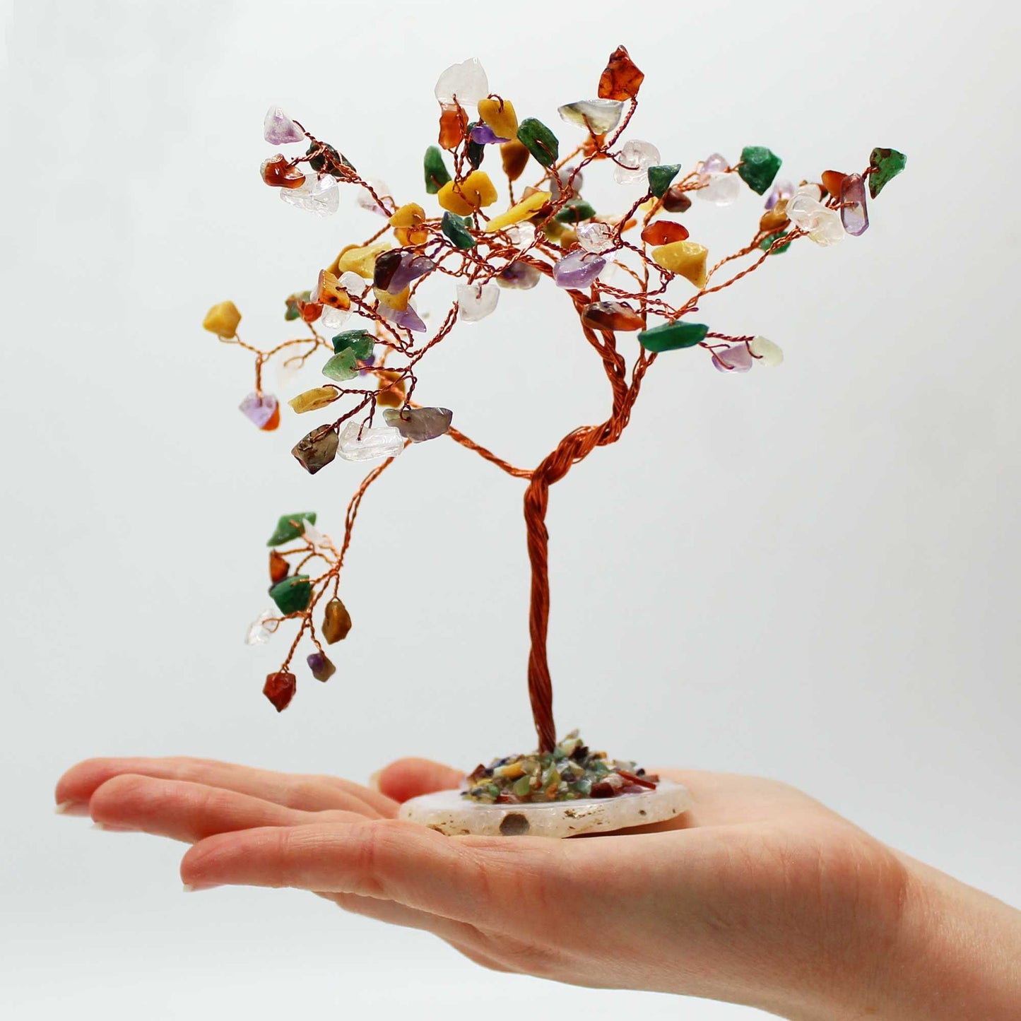 Multi-Stone Gemstone Tree on Natural Agate Base – 100 Stones, handmade wire bonsai with colorful gemstones displayed on a hand