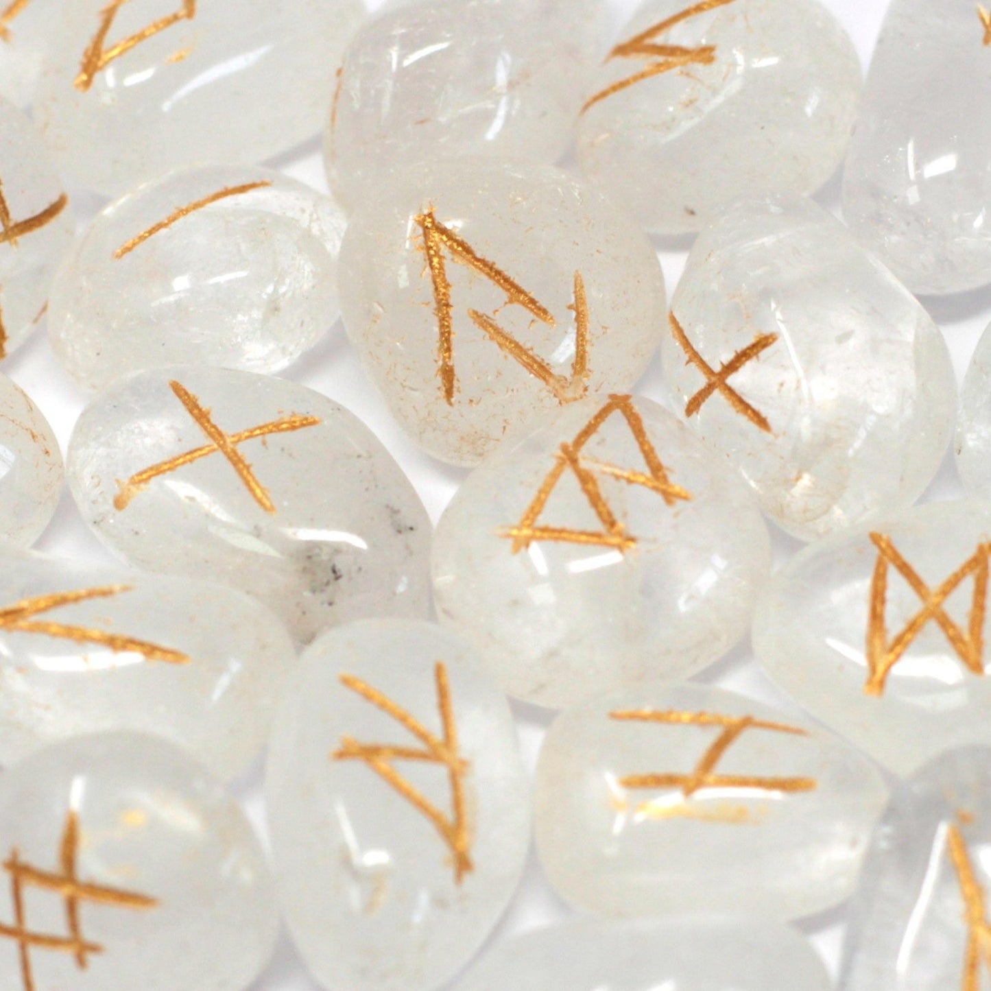 Alt Tag: Mystical Indian Rune Stone Set – Crystal Pouch, close-up of clear rune stones with gold symbols, 1.5 cm each
