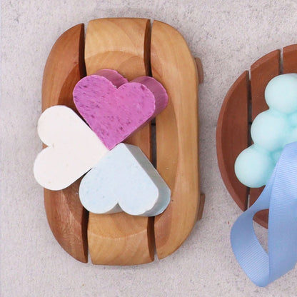 Alt Tag: Naseberry Wood Soap Dish – Oval in Rectangle with slatted oval-in-rectangle design holding heart-shaped soaps