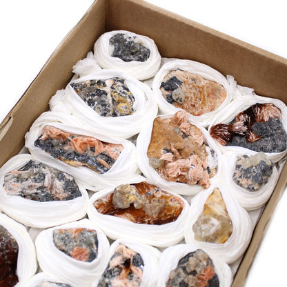 Natural Barite & Sericite Specimens – 60-Piece Collection mineral set in box, wrapped specimens showing varied colors and crystal textures