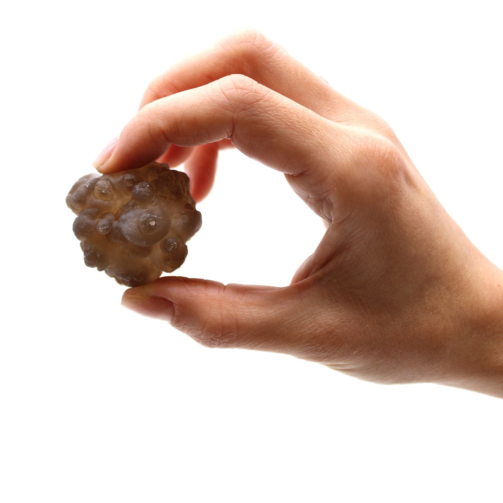 Alt Tag: Natural Chalcedony Mineral Specimens – 100-Piece Set, close-up of hand holding a natural chalcedony mineral specimen on white background