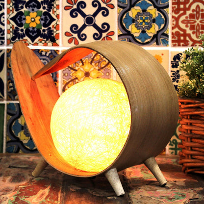 Natural Coconut Leaf Lamp – Unique Loop Design with cotton shade, handcrafted loop lamp glowing on table with colorful tile background