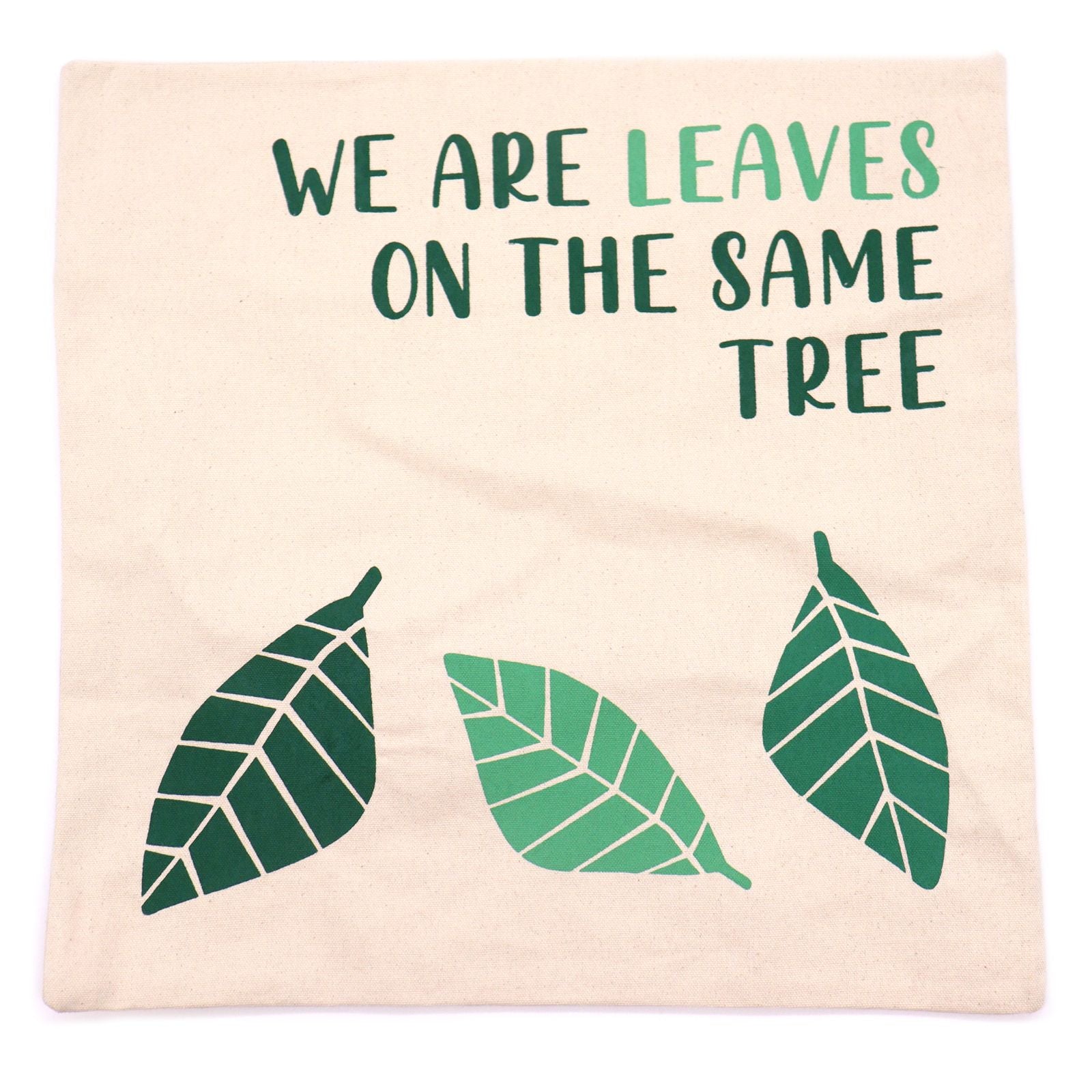 Natural Cotton Cushion Cover – We Are Leaves, 45x45 CM with “WE ARE LEAVES” text and green leaf print on natural cotton