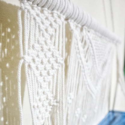 Alt Tag: Natural Cotton Macrame Shelf – Blue close-up of natural cotton macrame knots on hanging wall shelf with wood dowel