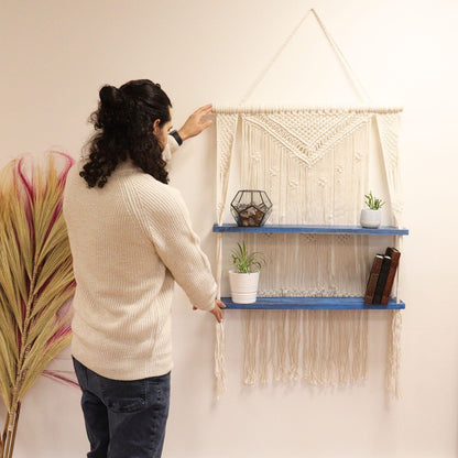 Natural Cotton Macrame Shelf – Blue wall hanging shelf with cotton macrame and wooden tiers, styled with plants and decor