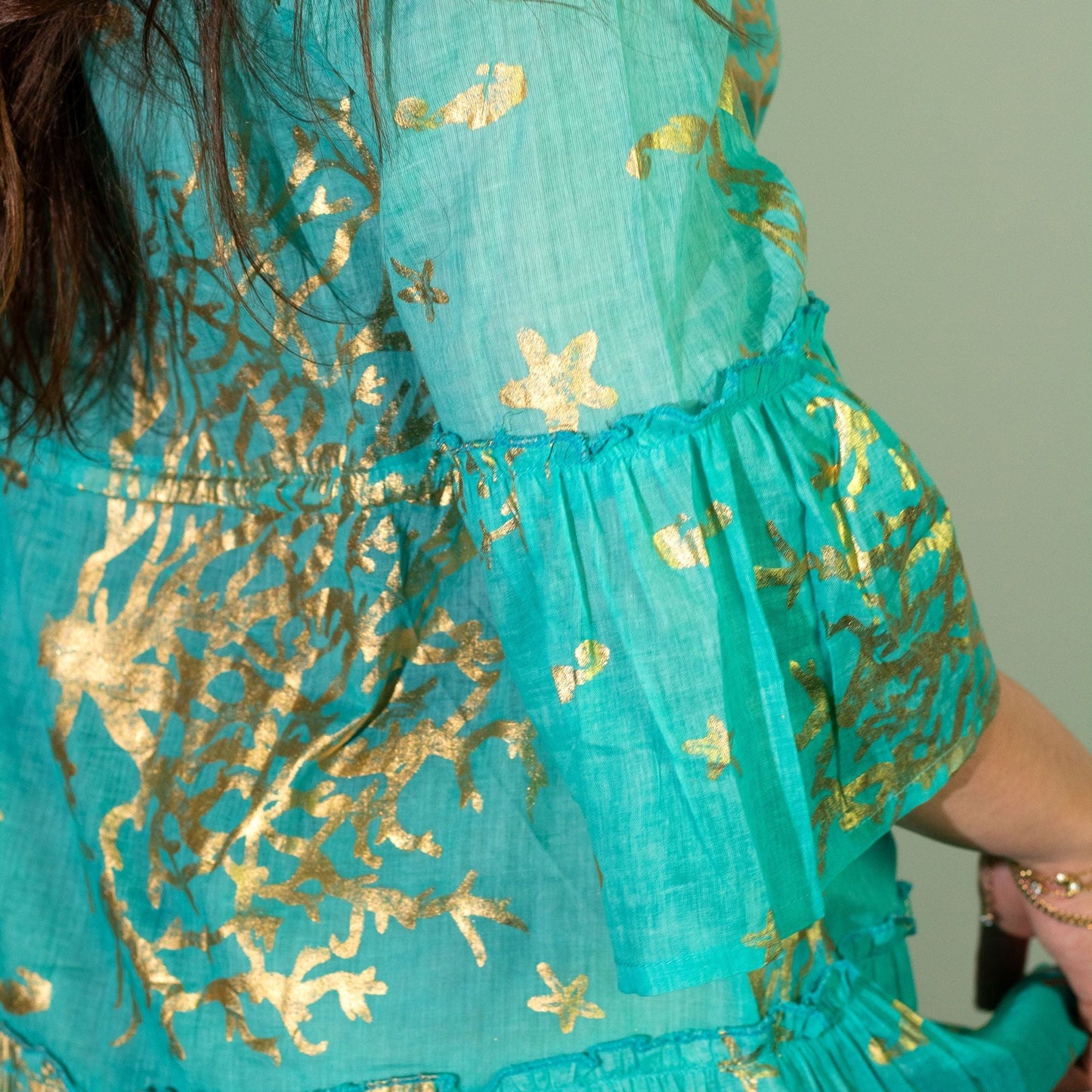 Nomad Sari Dress – Turquoise & Gold Coral Design (LXL), close-up of turquoise fabric with gold coral motifs and ruffle detail