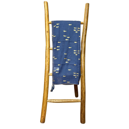 Alt Tag: Nomad Sari Pario – Sea Blue & Gold Fish Design sea-blue pario with gold fish motif draped on wooden ladder