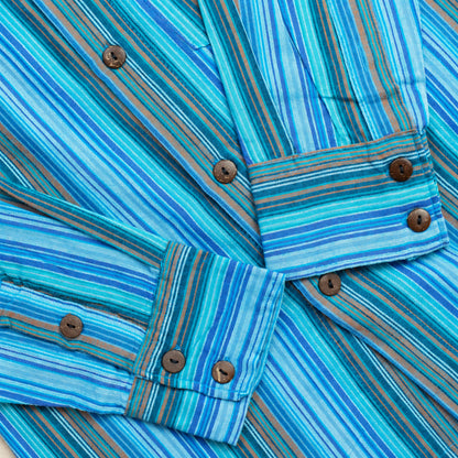 Partial close-up of the turquoise striped shirt’s two cuffs and sleeve openings, with brown buttons and visible stitching; the collar is outside the frame.