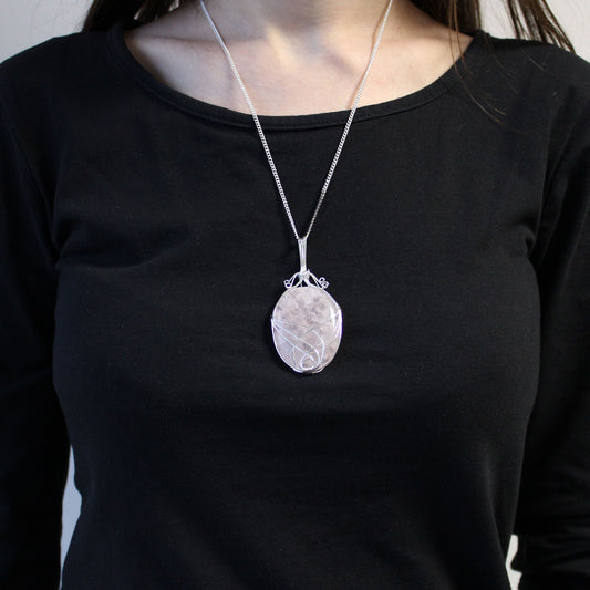 Alt Tag: Opulent Opalite Necklace – Silver Swirl 3.5x1 CM silver-plated swirl pendant with opalite gemstone, worn on chain