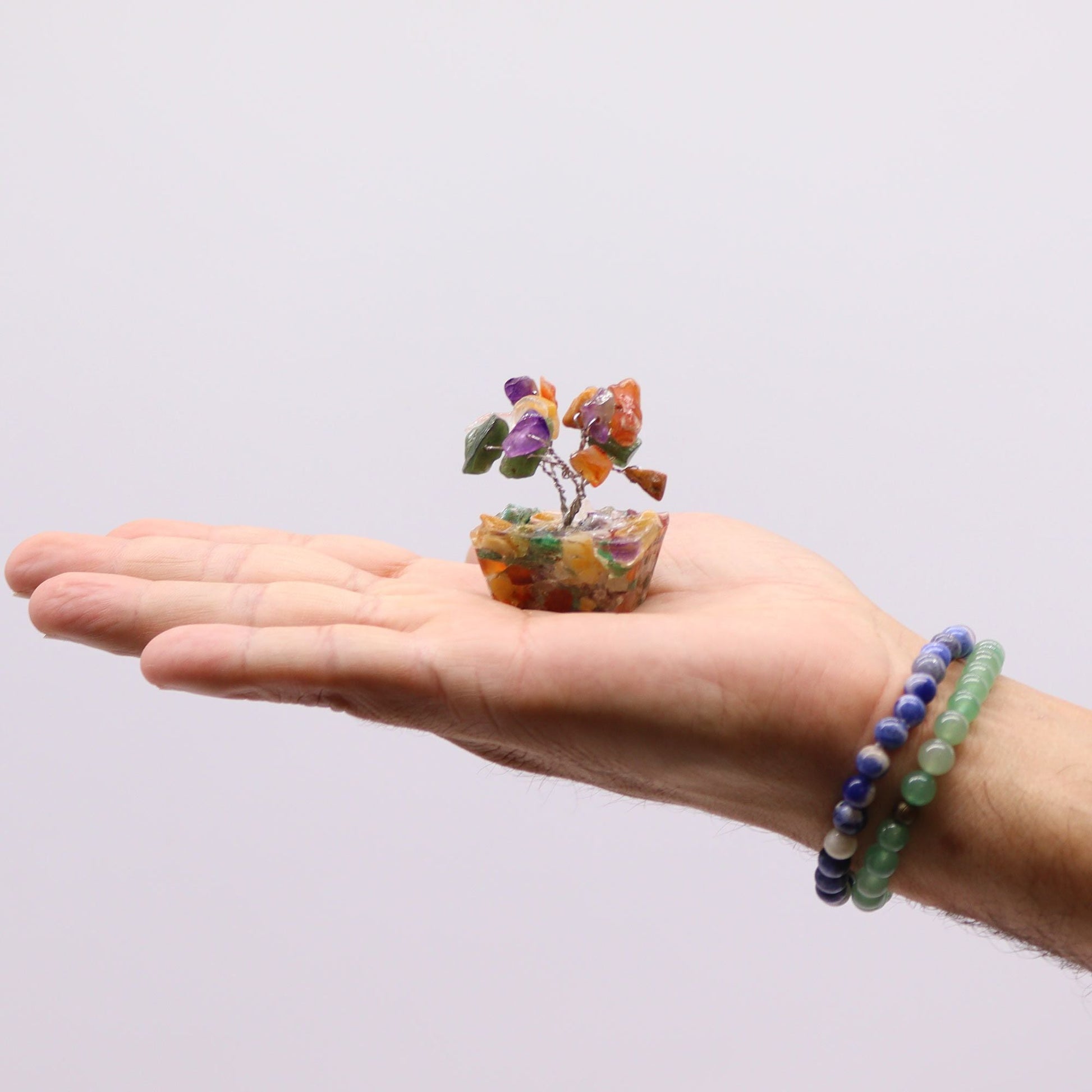 Alt Tag: Orgonite Base Mini Gemstone Tree – 15 Multi Stones mini árbol de piedras multicolor sobre base de orgonita en mano