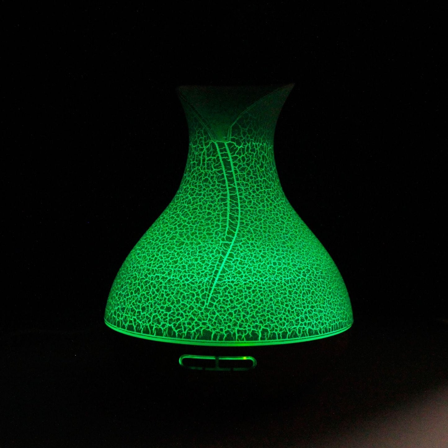 Palma Atomiser – Snäckeffekt – USB – Färgskiftning – Timer diffuser med snäckeffekt upplyst i grönt, framifrån
